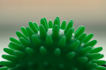 Green balloon, close-up, similar to a coronavirus