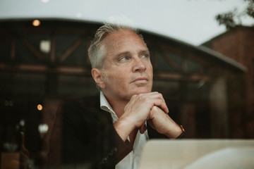 Thoughtful businessman at a cafe