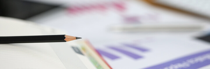 On table are financial instruments, reports diary