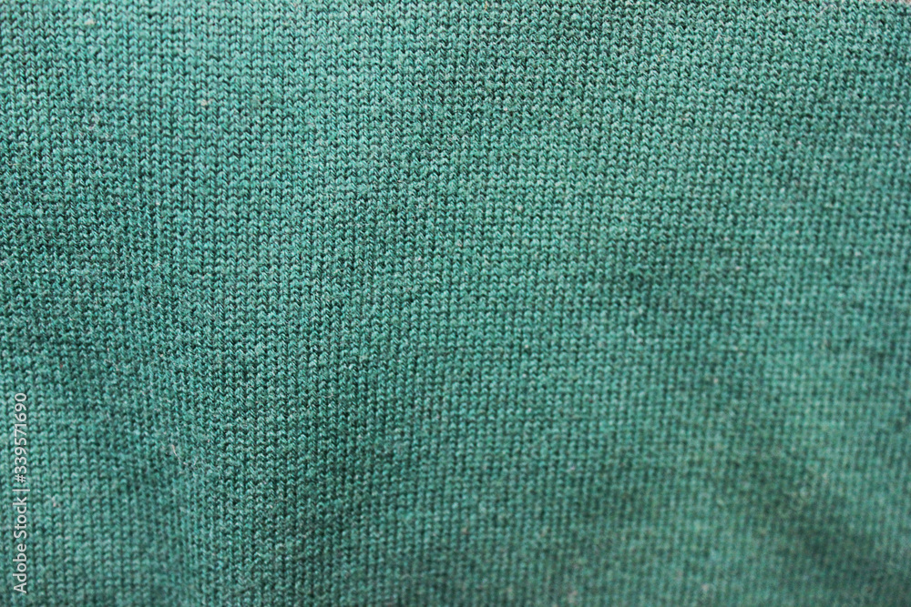 Sticker Mint green color fabric texture. Empty faded green colour cloth background, wrinkled textile surface, soft woven pale green texture clothing close up top view