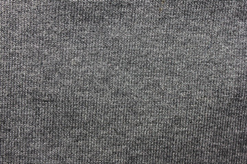 Grey fabric texture background. Gray seamless cloth backdrop, wool grey pattern on warm winter sweater