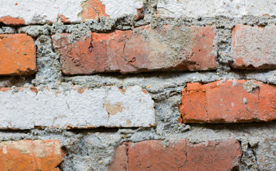 Obraz premium brick background. the wall is made of red-brown brick. Stone background and texture