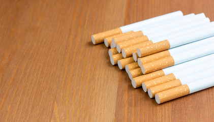 cigarette, cigarette on a wooden background with copy space,Concepts about the dangers of smoking