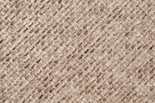 45 Degree Rotated Pattern Of A Decorative Beige Sackcloth Or Burlap Cloth. Close Up View.