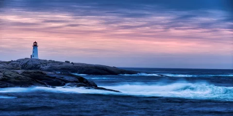 Wandcirkels aluminium lighthouse on the coast at sunrise © Igor