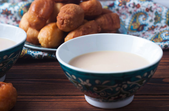 baursaki in a plate with a national pattern, Bashkir dishes, Uzbek dishes, oriental cuisine