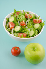 Diet concept image. Fresh salad and vegetable, calculator and measuring tab
