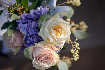 Rose and purple flower arraignment decoration for wedding outdoor setting