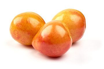Sweet yellow plums, isolated on white background
