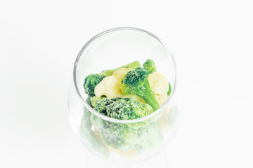 broccoli in a glass with onions