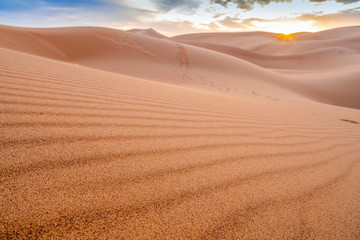 Beautiful sunset over sand dunes of Sahara Desert, Africa