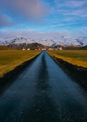 Iceland Road to Farm with mountains in background