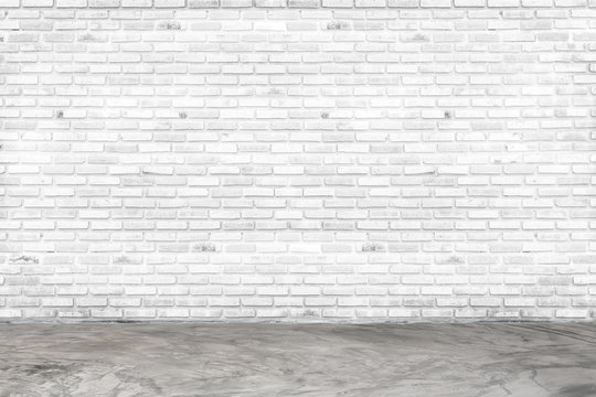 Empty white brick wall and concrete floor for background. room interior with white brick wall blank cement floor for backdrop.