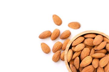 Closeup  brown Almond nuts in wooden bowl isolated on white background. Top view. Flat lay.