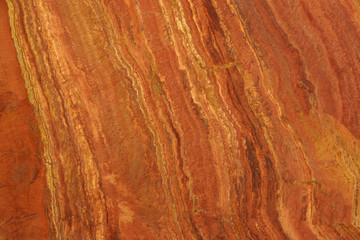 Naklejka premium Natural stone in the colors of lush stripes with stripes called Travertin Rosso