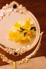 Yellow flowers in the mirror reflection. Narcissus. Mirror. Nuture