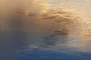 Abstract winter landscape of an ice pattern at sunrise, Lake Doster, Michigan, USA