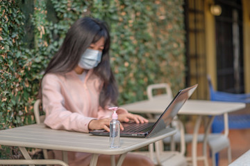 Obraz premium Mask and hand washing gel for germ prevention and the COVID-19 virus