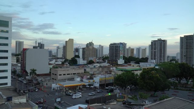 Beautiful view of city skyline buildings, houses, traffic and streets at dusk in downtown Cuiaba neighborhood, Mato Grosso, Brazil. Concept of architecture, urban, modern and development. 4K