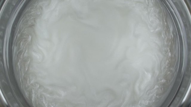 Rheoscopic fluid. Beautiful movement of particles in a liquid. Fantastic patterns and shapes. 50 fps