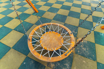 Playground with swings for children and soft rubber crumb in Moscow, Russia