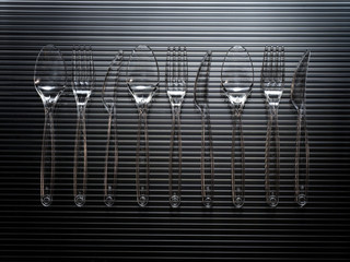 Sfondo con posate in plastica trasparente