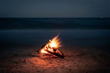 Inviting campfire on the beach during the summer, bring back fond memories