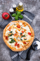 Italian pizza with tomato, mozzarella and chicken