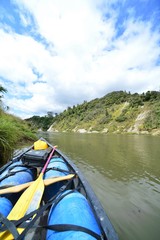 Fototapeta premium Canoe with barrels on the Tongariro River in the Tongariro National Park on the side of the jungle