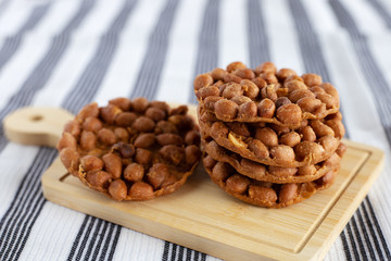 Thai fried peanut cookies for asian dessert, food and eating concept