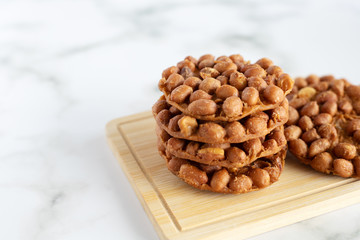 Thai fried peanut cookies for asian dessert, food and eating concept