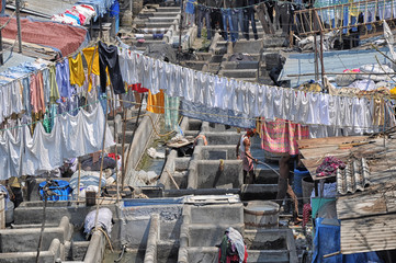 Mumbai, India-March 03,2013: Laundry Dhobi Ghat in Mumbai, people wash clothes on a city street....