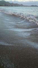 Wave of the sea on the sand beach