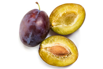 Two fresh plums on a white