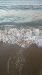 Wave of the sea on the sand beach