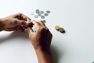 Close-up counting money coins in working from home, COVID-19.