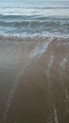 Wave of the sea on the sand beach