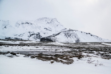 Fototapeta na wymiar snow covered mountains in iceland