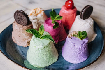 tasty handmade eco ice cream  in different colours served on a beautiful plate