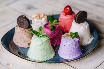 tasty handmade eco ice cream  in different colours served on a beautiful plate