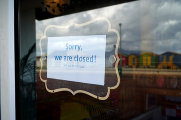 Closed shop sign in a window