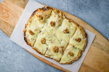 Roman pizza four cheeses on Roman dough, pinsa