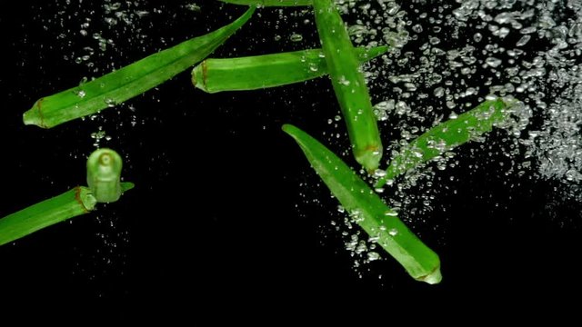 okra drop in water slow motion
