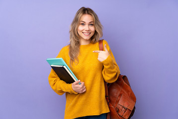 Teenager Russian student girl isolated on purple background with surprise facial expression