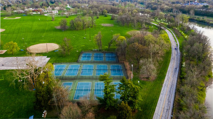 Fototapeta na wymiar An aerial view of tennis courts in a public park