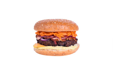 Fresh burger with pork and beef cutlet, bacon, cheddar cheese, korean carrots, pickled onions, caesar sauce isolated on white background.