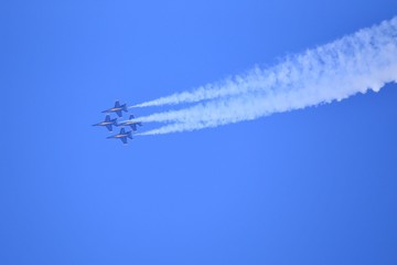 Military jet aircraft in the overhead sky