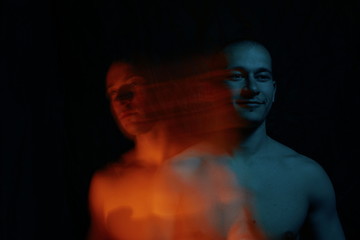 Personality disorder against black background with blurred face