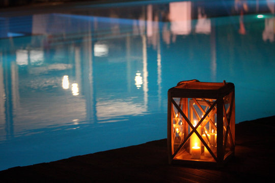 night swimming pool and candles