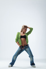 young woman jumping on studio backdrop